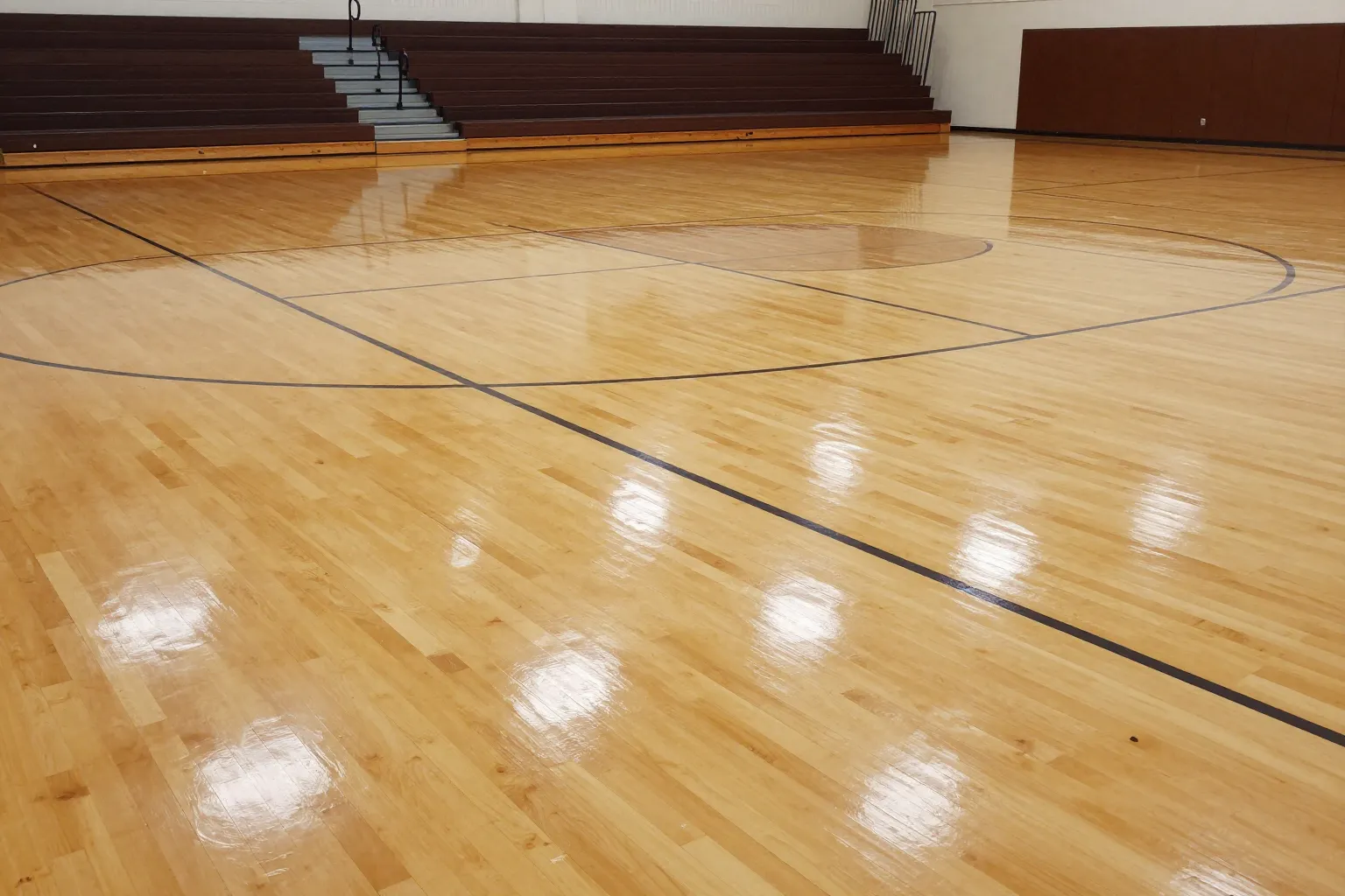 Freshly waxed gymnasium hardwood floor