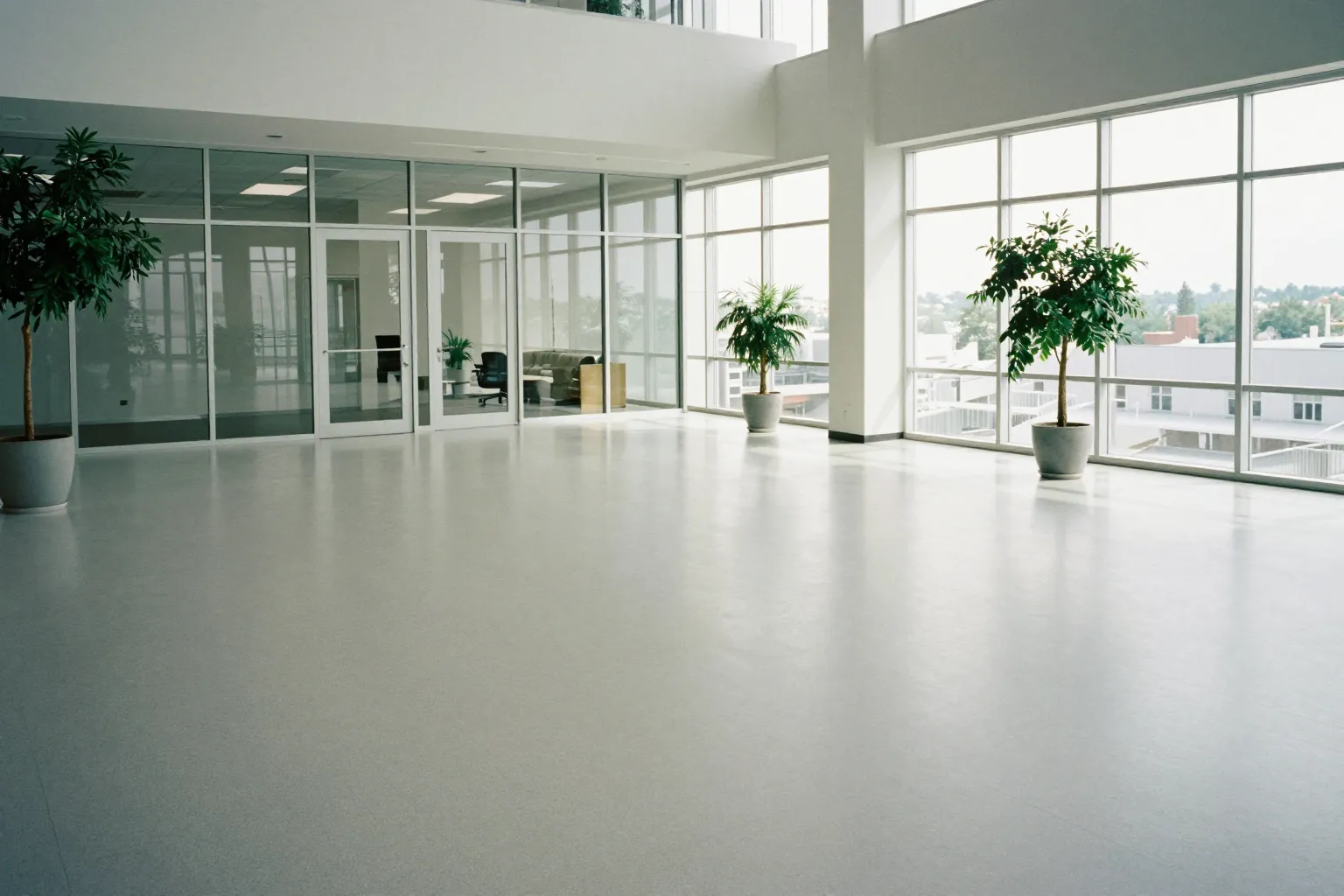 Polished floor of an empty office lobby in morning light